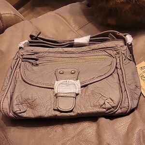Gray Crossbody Bag with Adjustable Strap and Textured Material